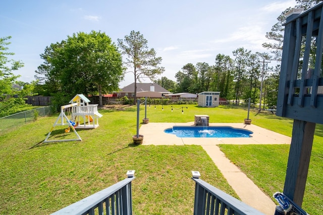 2 Alexander Loop, Phenix City, AL 36869 - view of yard featuring a storage unit, a playground, an outdoor structure, and a patio area