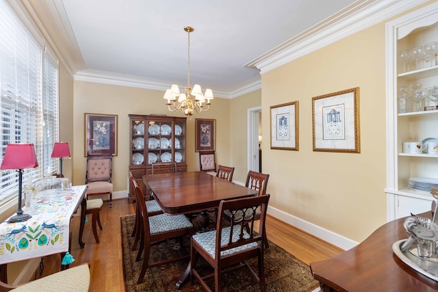 1811 Park Dr, Columbus, GA 31906 - dining area featuring a chandelier, light wood-type flooring, and crown molding