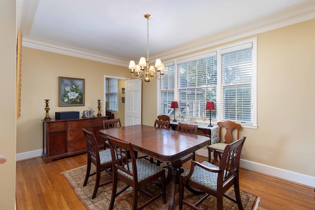 1811 Park Dr, Columbus, GA 31906 - dining room featuring crown molding, a chandelier, and light wood-style flooring