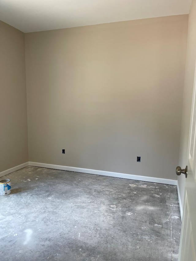 spare room with concrete flooring