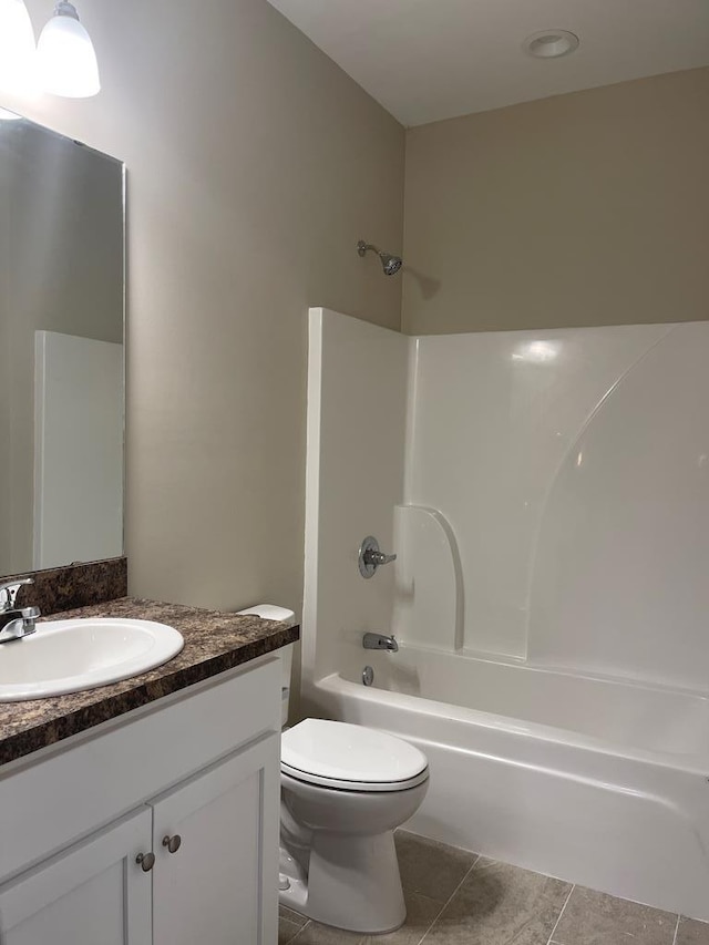 full bathroom with tile patterned flooring, vanity, toilet, and tub / shower combination