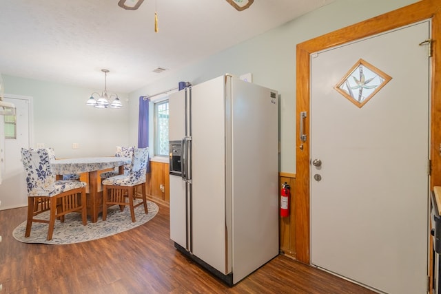 4833 Marino St, Columbus, GA 31907 - kitchen with white fridge with ice dispenser, dark wood finished floors, a chandelier, light countertops, and decorative light fixtures