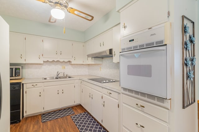 4833 Marino St, Columbus, GA 31907 - kitchen with under cabinet range hood, electric cooktop, oven, dishwasher, and stainless steel microwave