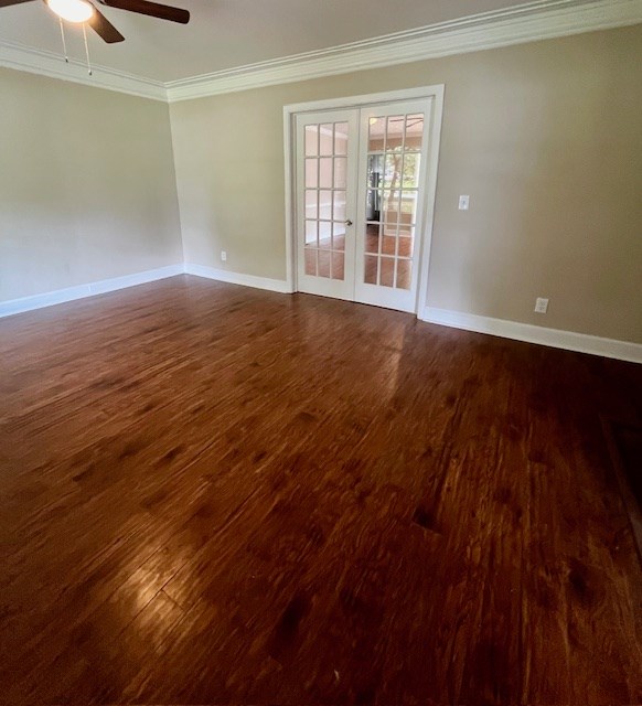 1555 Wells Dr, Columbus, GA 31906 - spare room featuring french doors, ornamental molding, ceiling fan, and dark wood-type flooring