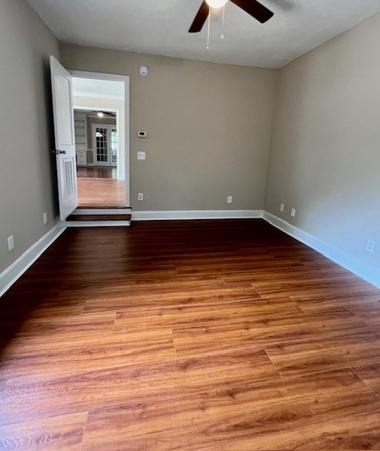 1555 Wells Dr, Columbus, GA 31906 - spare room with a ceiling fan and wood finished floors