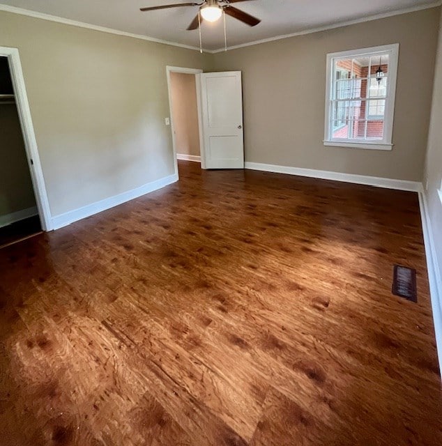 1555 Wells Dr, Columbus, GA 31906 - unfurnished bedroom with wood finished floors, ornamental molding, and a ceiling fan