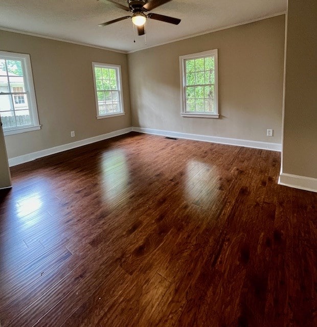 1555 Wells Dr, Columbus, GA 31906 - spare room featuring ornamental molding, dark wood-type flooring, and a ceiling fan
