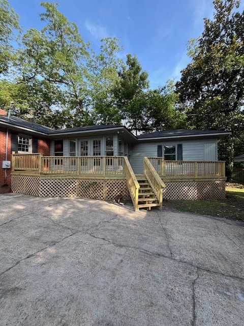 1555 Wells Dr, Columbus, GA 31906 - view of front of property with a deck and driveway