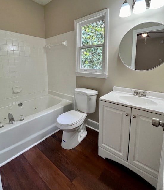 1555 Wells Dr, Columbus, GA 31906 - full bath with wood finished floors, vanity, and  shower combination