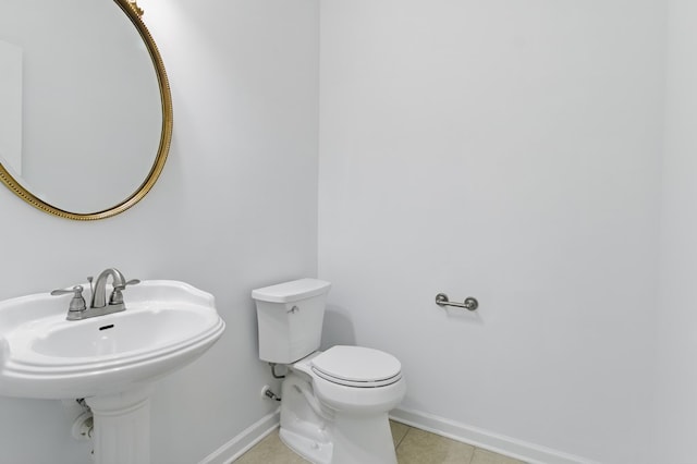 4685 Ivy Patch Dr, Fortson, GA 31808 - bathroom with baseboards, toilet, tile patterned floors, and a sink