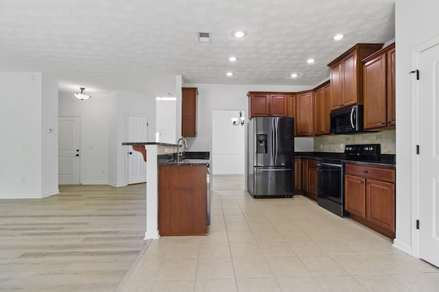 4685 Ivy Patch Dr, Fortson, GA 31808 - kitchen with stainless steel fridge with ice dispenser, black electric range oven, a peninsula, a breakfast bar, and backsplash