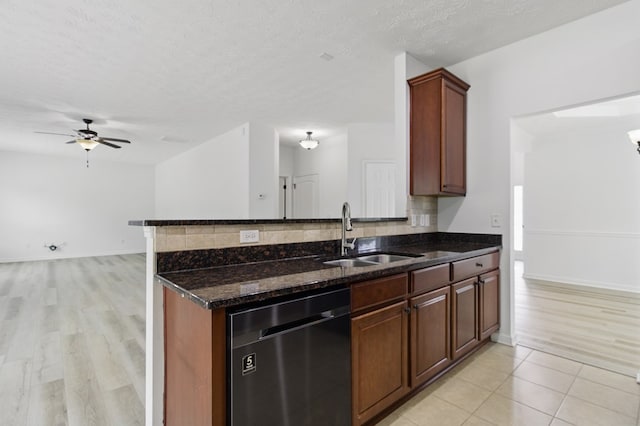 4685 Ivy Patch Dr, Fortson, GA 31808 - kitchen with dishwasher, a sink, dark stone counters, a ceiling fan, and light wood-style floors