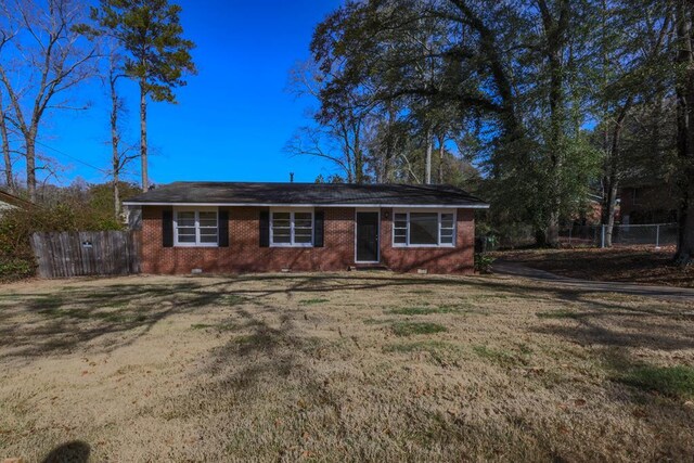 ranch-style house with a front yard