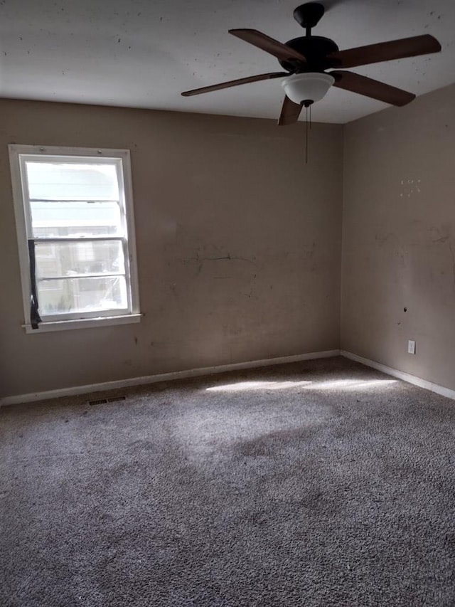 empty room with carpet floors and ceiling fan