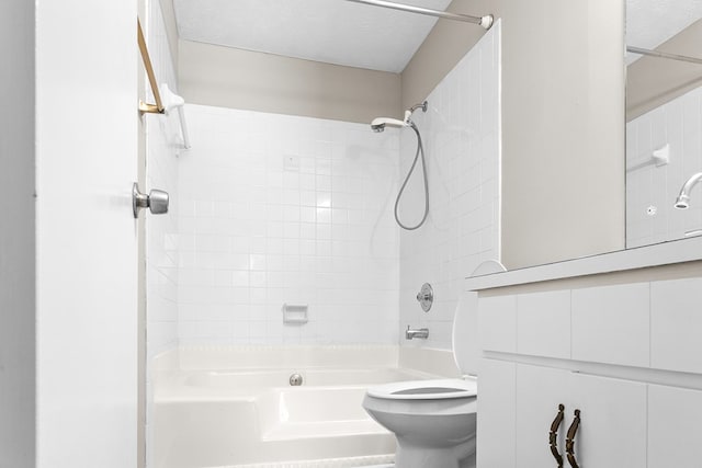 bathroom featuring shower / washtub combination, a textured ceiling, and toilet