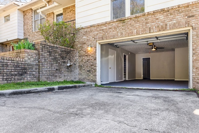 garage with aphalt driveway