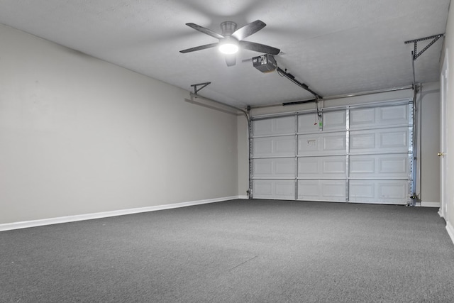 garage featuring baseboards, a ceiling fan, and a garage door opener