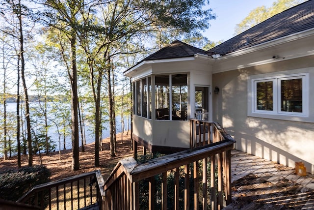 wooden deck with a sunroom