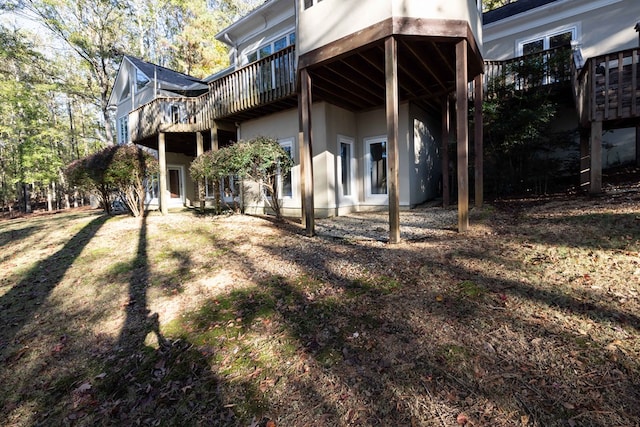 back of house featuring stucco siding