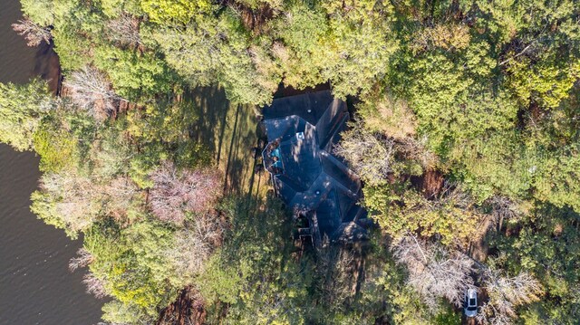 drone / aerial view featuring a forest view