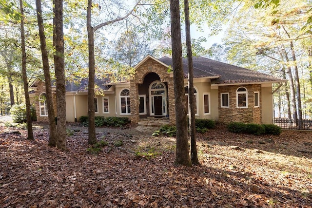 view of front of property with stone siding and stucco siding