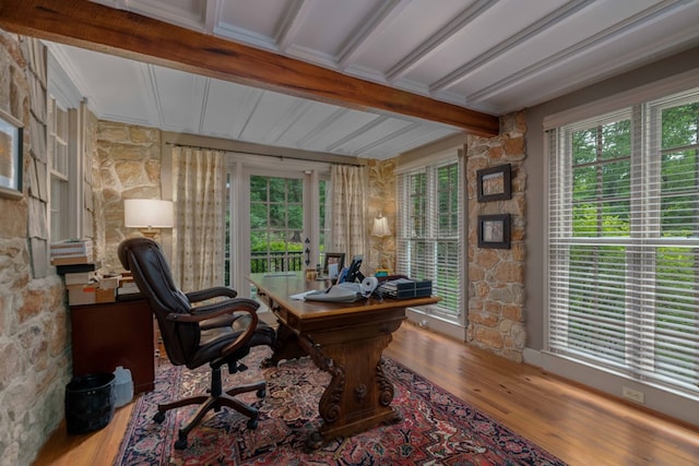 office featuring beam ceiling, wood finished floors, and a wealth of natural light