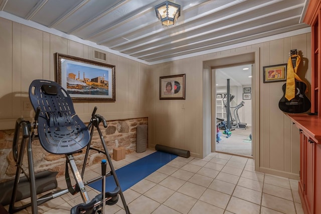 workout area featuring visible vents and light tile patterned flooring