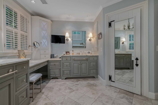 bathroom featuring ornamental molding, vanity, visible vents, and baseboards