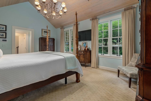 bedroom featuring a chandelier, vaulted ceiling, baseboards, and light colored carpet