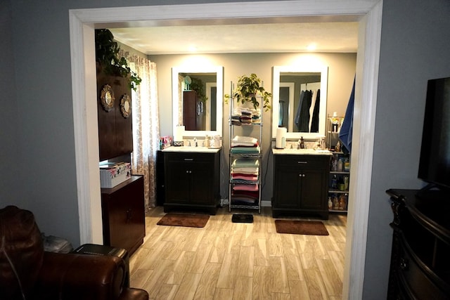 404 19th Ave, Phenix City, AL 36869 - bathroom with two vanities and wood finished floors