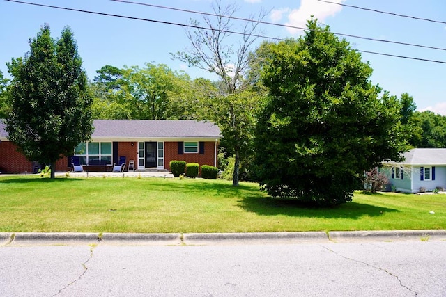 404 19th Ave, Phenix City, AL 36869 - ranch-style home with a front yard and brick siding