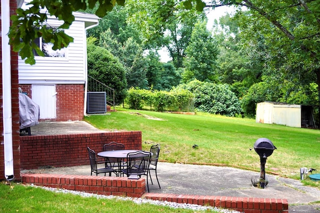 404 19th Ave, Phenix City, AL 36869 - view of green lawn featuring a patio area, stairway, and a storage shed
