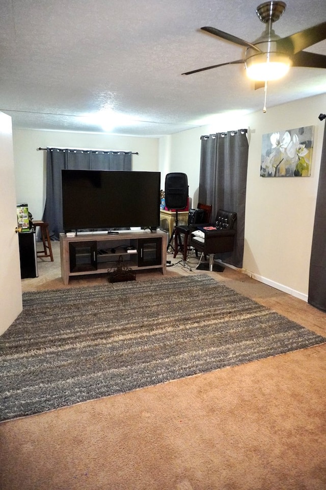 404 19th Ave, Phenix City, AL 36869 - carpeted living area with a textured ceiling and ceiling fan