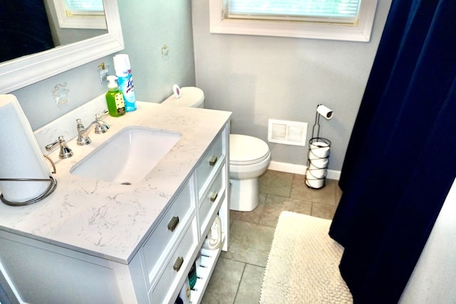 404 19th Ave, Phenix City, AL 36869 - bathroom with vanity and tile patterned floors