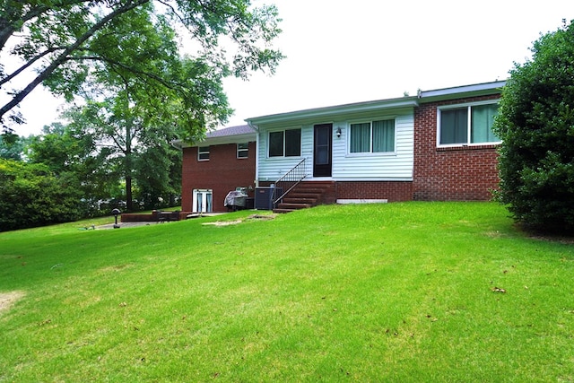 404 19th Ave, Phenix City, AL 36869 - back of property featuring entry steps, brick siding, and a lawn