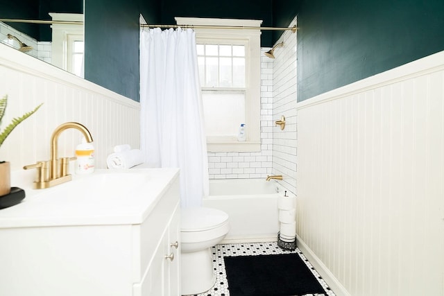 1240 Peacock Ave, Columbus, GA 31906 - full bathroom featuring vanity, shower / bath combo with shower curtain, and a wainscoted wall