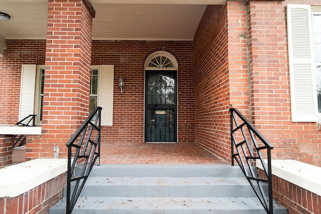1240 Peacock Ave, Columbus, GA 31906 - doorway to property featuring brick siding and covered porch