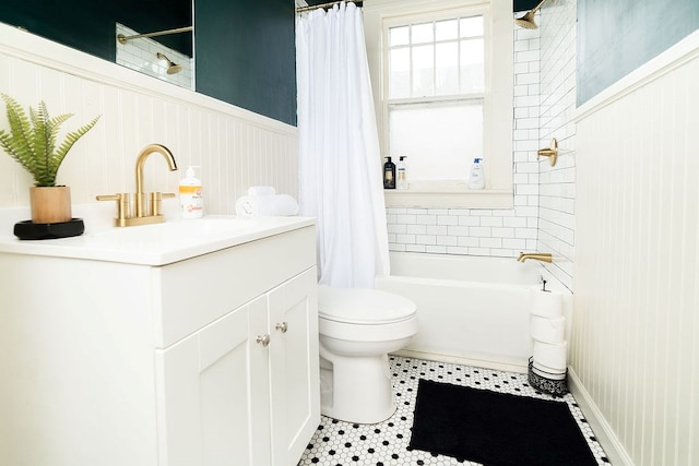 1240 Peacock Ave, Columbus, GA 31906 - bathroom with shower / bath combination with curtain, vanity, a wainscoted wall, and tile patterned flooring