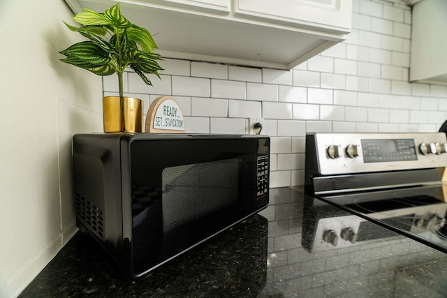 1240 Peacock Ave, Columbus, GA 31906 - kitchen view of stainless steel electric range oven and dark countertops