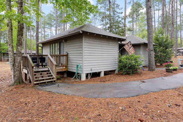 2387 Cedar Ln, Pine Mountain, GA 31822 - view of home's exterior featuring a wooden deck and a shingled roof