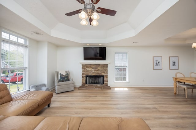3022 Thornberry Cir, Phenix City, AL 36867 - living area with a tray ceiling, plenty of natural light, light wood-type flooring, and ceiling fan