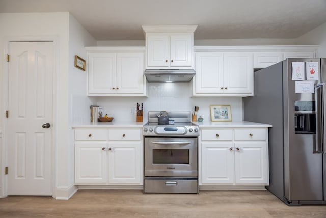 3022 Thornberry Cir, Phenix City, AL 36867 - kitchen with stainless steel appliances, under cabinet range hood, light wood-style floors, white cabinets, and light countertops
