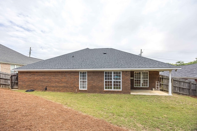 3022 Thornberry Cir, Phenix City, AL 36867 - back of property with a shingled roof, a patio, and brick siding