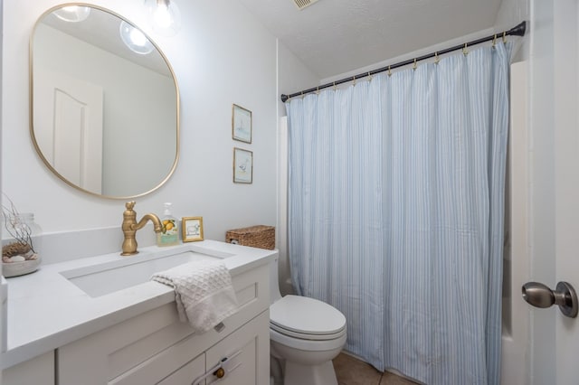 3022 Thornberry Cir, Phenix City, AL 36867 - full bath with toilet, vanity, a textured ceiling, a shower with shower curtain, and tile patterned floors
