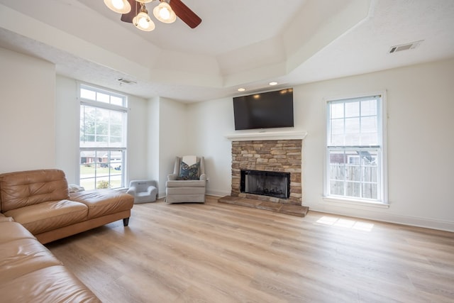3022 Thornberry Cir, Phenix City, AL 36867 - living area with plenty of natural light, light wood-type flooring, and a stone fireplace