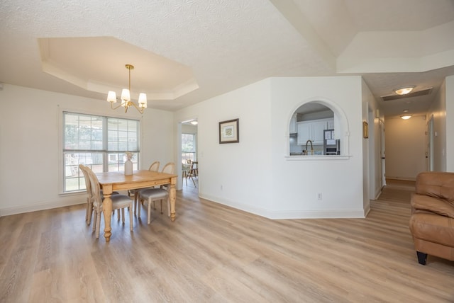 3022 Thornberry Cir, Phenix City, AL 36867 - dining area with a raised ceiling, baseboards, a chandelier, and a textured ceiling
