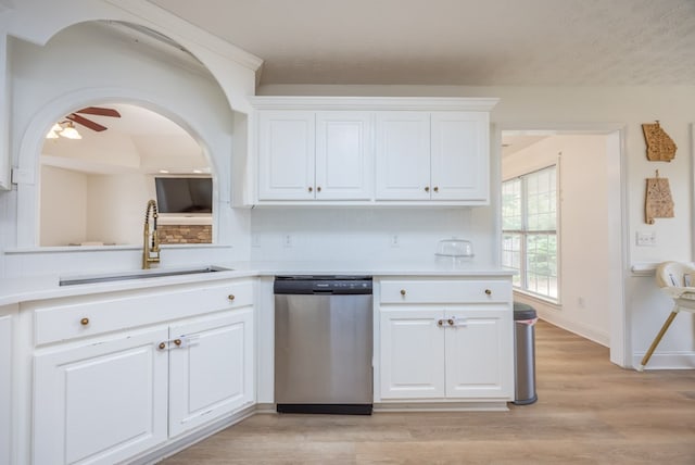 3022 Thornberry Cir, Phenix City, AL 36867 - kitchen featuring stainless steel dishwasher, a sink, light countertops, white cabinets, and a textured ceiling
