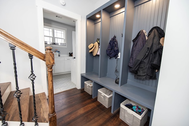 mudroom with dark hardwood / wood-style floors