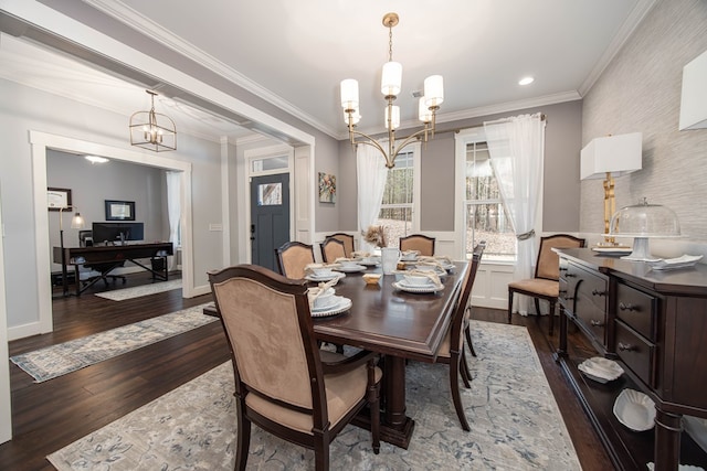 dining room featuring dark hardwood / wood-style flooring, a notable chandelier, and ornamental molding