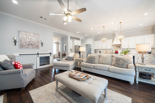 living room featuring ornamental molding, dark hardwood / wood-style floors, and ceiling fan